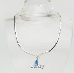 Elegant modern sterling silver links and blue glass drop necklace