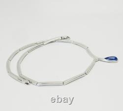 Elegant modern sterling silver links and blue glass drop necklace
