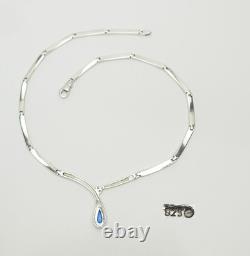 Elegant modern sterling silver links and blue glass drop necklace