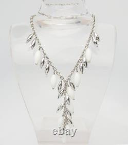 Elegant sterling silver white glass lariat dangle necklace by Angelique de Paris