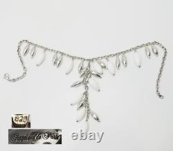 Elegant sterling silver white glass lariat dangle necklace by Angelique de Paris