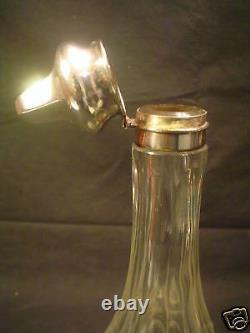 Pair American Engraved Cut Glass Bottles, Sterling Silver Tops, c. 1900