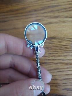 Vintage sterling silver roses magnifying glass pendant